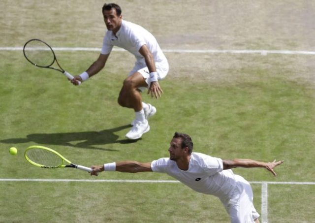 421814_ivan dodig filip polasek wimbledon 676x478.jpg