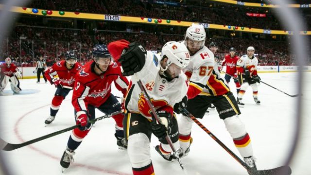 428457_tobias rieder michael frolik nick jensen nhl washington capitals calgary flames 676x451.jpg