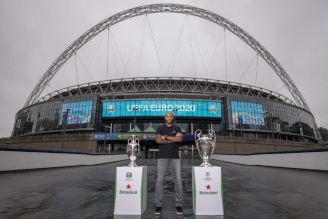 430756_henry with euro and ucl trophy with wembley arch backdrop 2 676x451.jpg