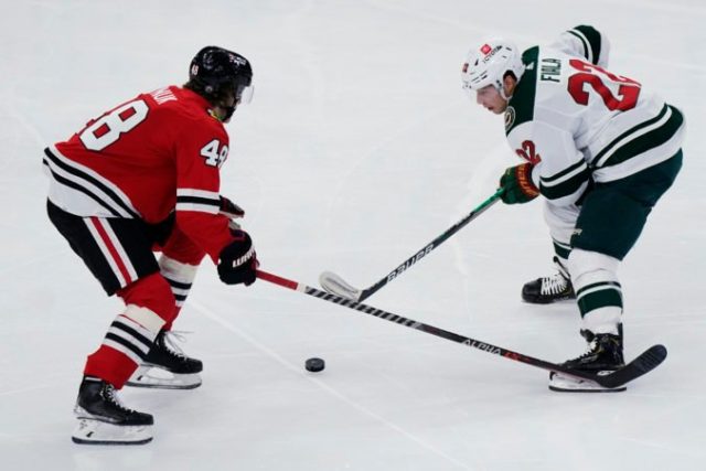 478936_wild_blackhawks_hockey_07794 a4f2fb03e92d45a8820857243728f1ba 676x451.jpg