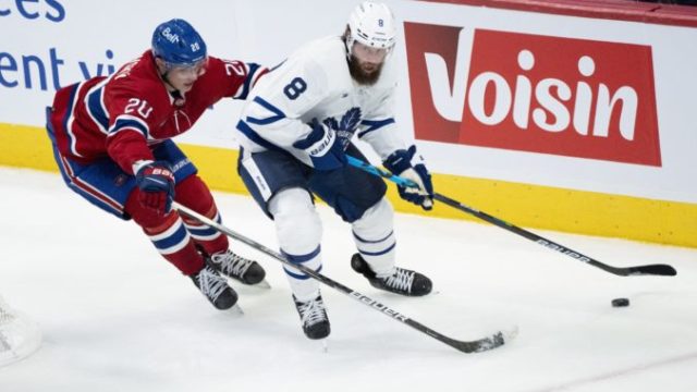 494152_jake muzzin juraj slafkovsky nhl toronto maple leafs montreal canadiens 676x446.jpg