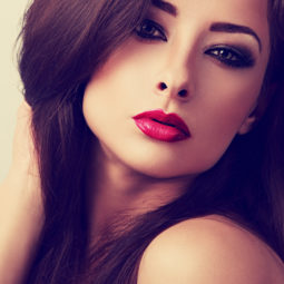 Beautiful evening makeup woman with red lipstick looking sexy. C