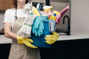 Holding bucket of cleaning supplies_4460x4460.jpg