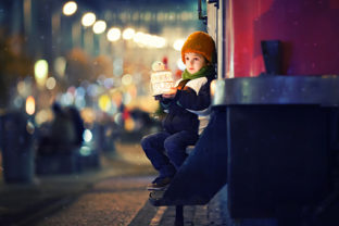 Cute boy, holding lantern outdoor, wintertime