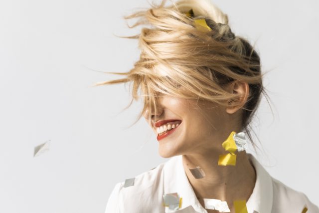 Portrait of Happy Party Girl Dancing