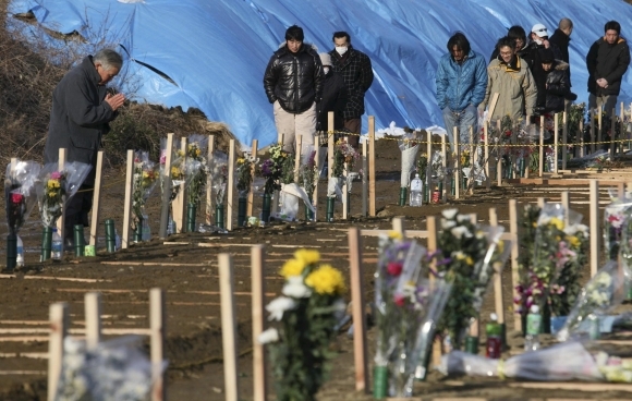 Pohreb obetí katastrofy v meste Yamamoto