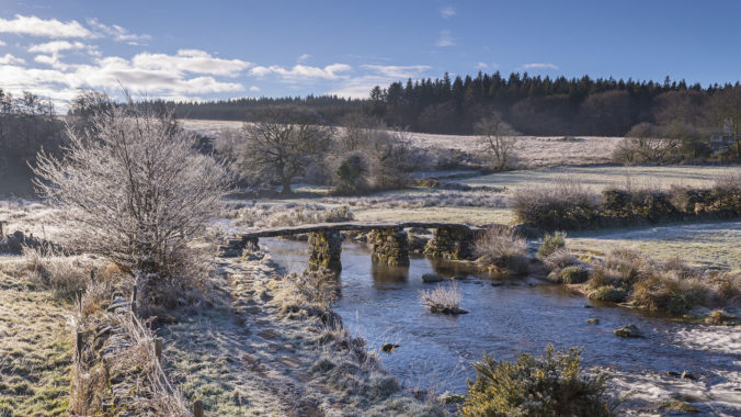 Frosty winter conditions at the old clapper bridge at Postbridge, Dartmoor, Devon, England, United Kingdom, Europe