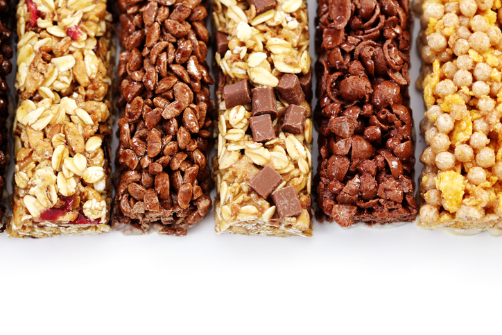 Five energy bars made out of a variety of ingredients