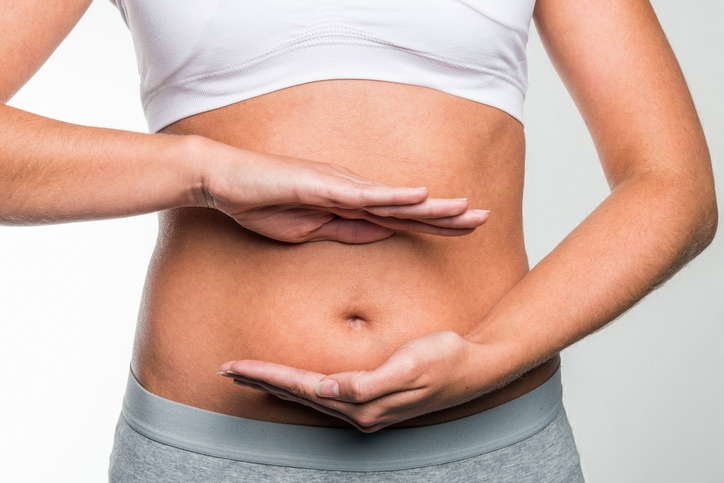 Circle of hands on stomach