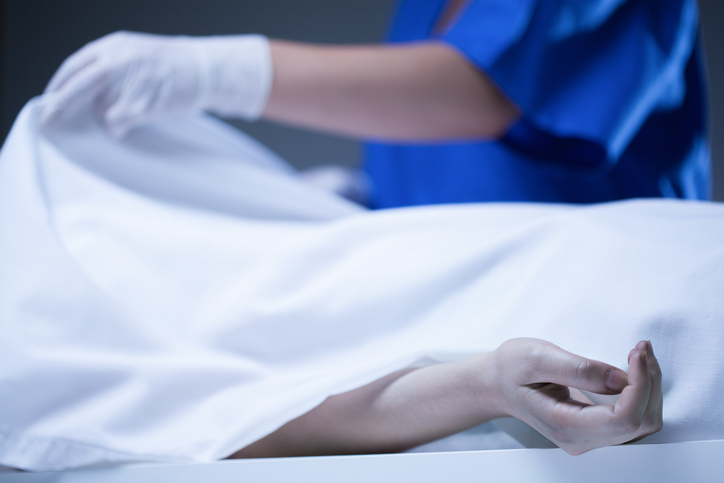Corpse covered by sheet