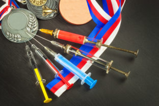 Syringe and medals. Doping in sport. Doping athletes.