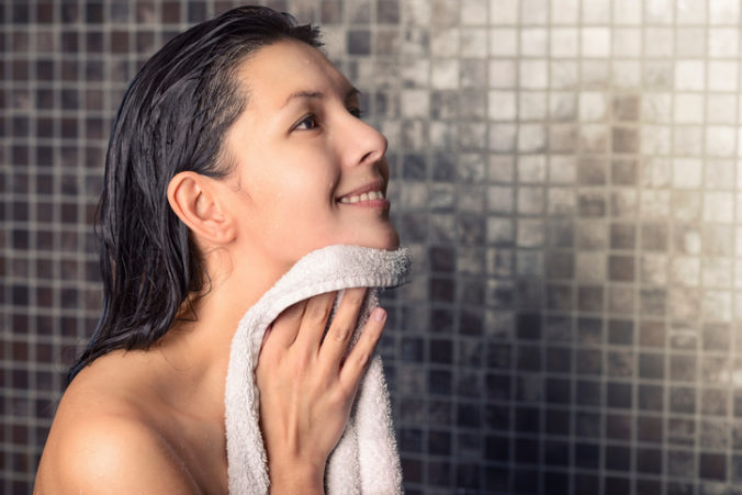 Smiling woman in a shower