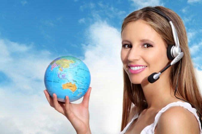 Receptionist with headphones and globe