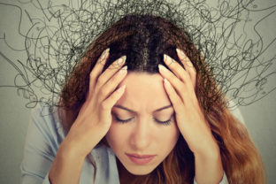 Woman with stressed face expression brain melting into lines