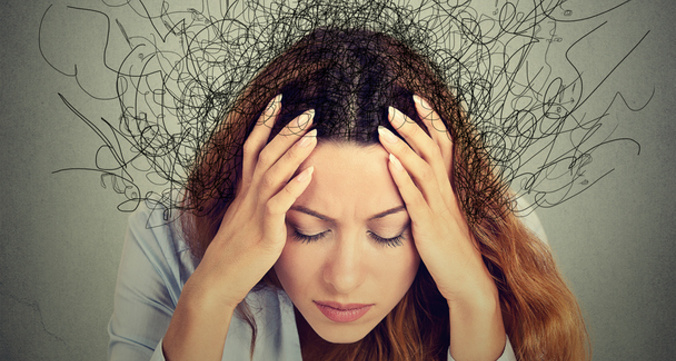 Woman with stressed face expression brain melting into lines