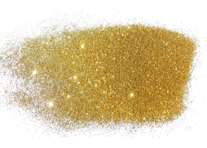 Golden glitter sparkles on white background