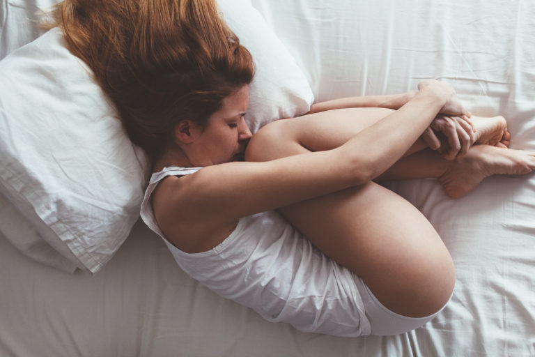 Lying down and sad