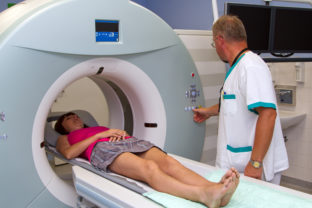 Woman as a patient being investigated for magnetic resonance sca