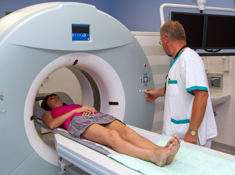 Woman as a patient being investigated for magnetic resonance sca