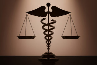 Medical Caduceus Symbol as Scales with backlight over Wall