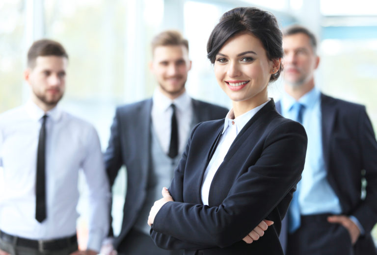 Beautiful woman on the background of business people