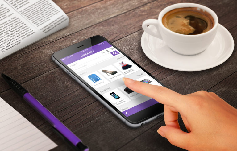 Woman on line shopping with smart phone on wooden table relax time with coffee newspaper pencil growing marketing concept