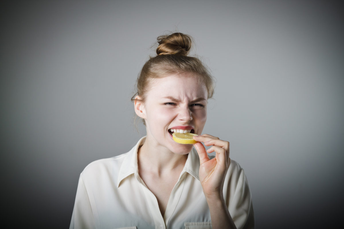 Young slim woman with lemon_shutterstock_325339439.jpg