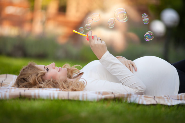 Beautiful pregnant woman in spring outdoor