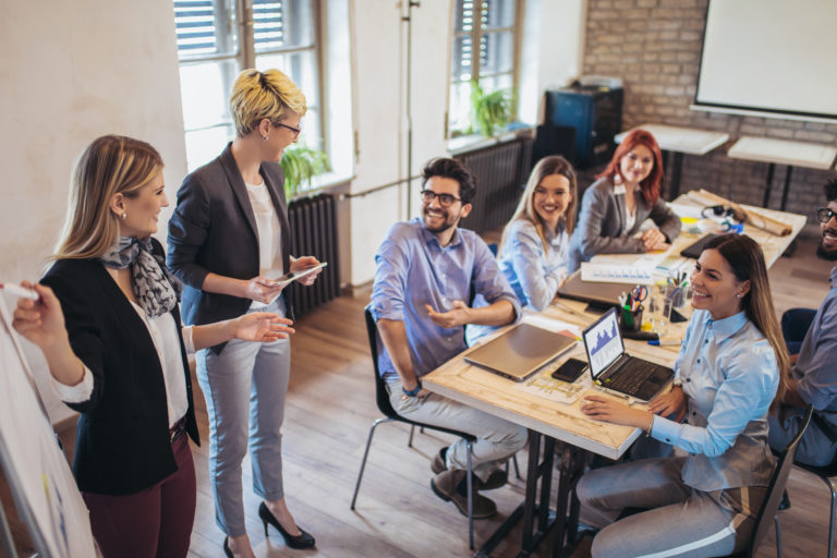 Business colleagues in conference meeting room during presentation