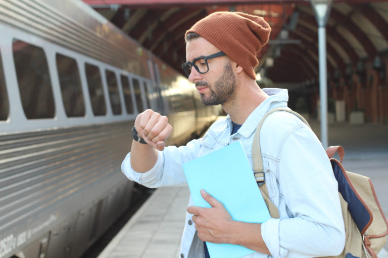 Male showing impatience at the station