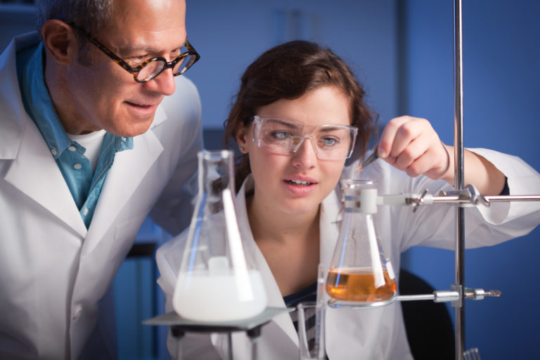 Research Technicians Working Together in Laboratory Facility Horizontal