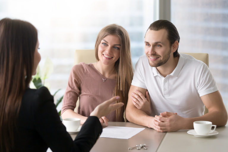 Couple applying for mortgage, taking bank loan to buy property