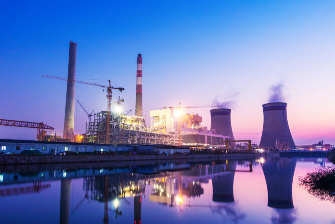 Power plant near river at twilight