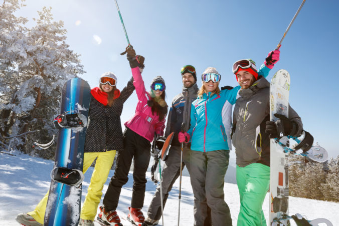 Cheerful friends on mountain skiing