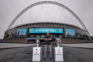 Henry with euro and ucl trophy with wembley arch backdrop 2.jpg