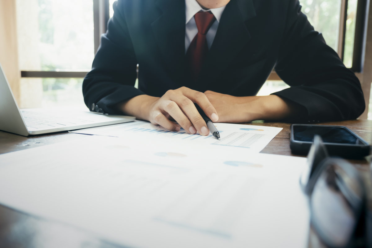 Businessman analyse investment marketing data.