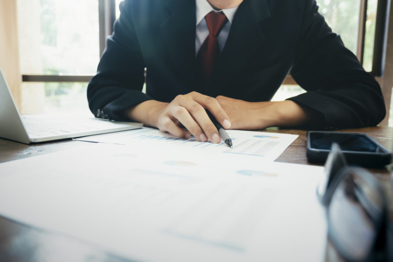 Businessman analyse investment marketing data.