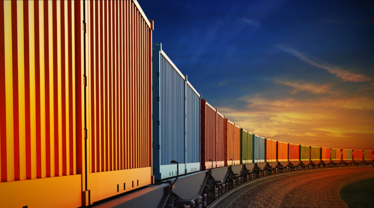 Wagon of freight train with containers on the sky background