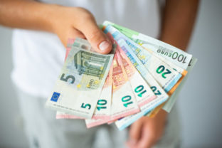 Man hands holding euro banknotes. Selective focus