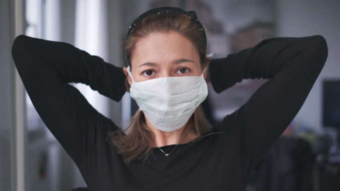 Horizontal background of woman wearing surgical mask for corona virus isolation