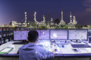 Double exposure of Engineering works with the tablet in the production control room.Control room of a steam Turbine,Generators of the coal fired power plant for monitor process, business and industry