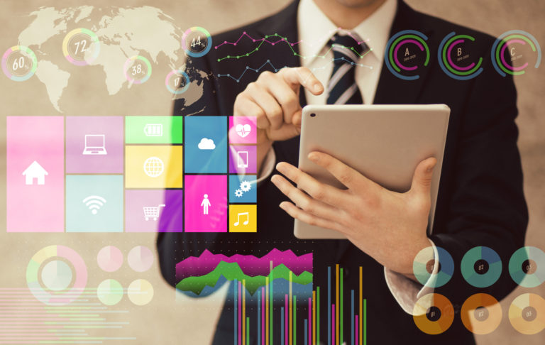 Businessman using tablet PC and various business information. paperless office.