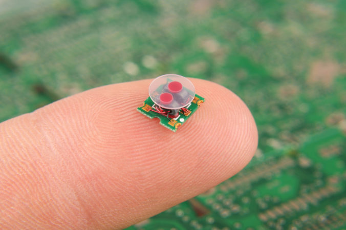 Small electronics component RF transformer on human finger