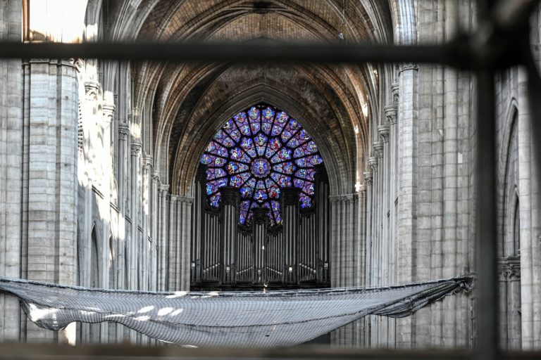 FILE - This July 17, 2019 file photo shows the big organ during preliminary work at the Notre-Dame de Paris, in Paris. Pipe by precious pipe, the organ that once thundered through fire-ravaged Notre Dame Cathedral is being taken apart. The mammoth task of dismantling, cleaning and re-assembling France's largest musical instrument started Monday Aug.3, 2020 and is expected to last nearly four years. (S)