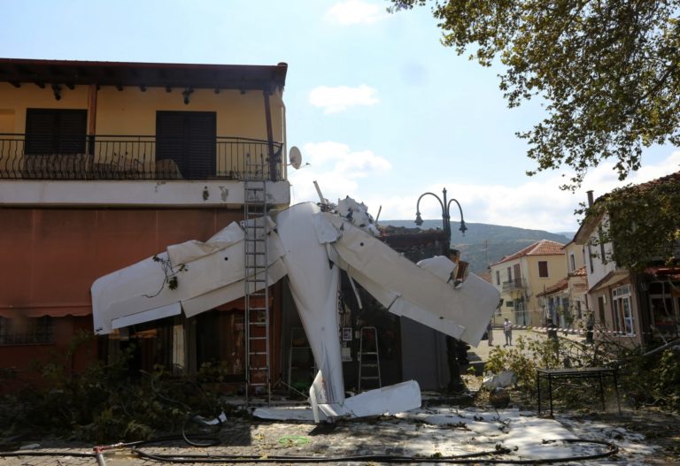 A small plane lays on a building after a crash in the village of Proti, near Serres town, northern Greece, on Monday, Aug. 3, 2020. The single-engine plane crashed on Monday morning into the front of a small building but no injuries were reported and the pilot of the Cessna aircraft is well.