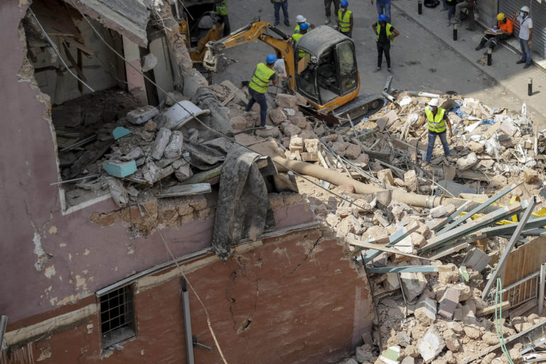 Rescuers search at the site of a collapsed building after getting signals there may be a survivor under the rubble, in Beirut, Lebanon, Saturday, Sept. 5, 2020. A pulsing signal was detected Thursday from under the rubble of a Beirut building that collapsed during the horrific port explosion in the Lebanese capital last month, raising hopes there may be a survivor still buried there.