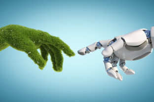 Nature and technology abstract concept, robot hand and natural hand covered with grass