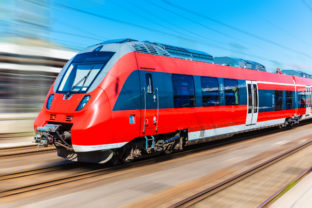 Red high speed train with blurred motion