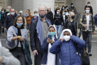 Faithful and nuns wear face masks to stop the spread of COVID-19, at the Vatican, Tuesday, Oct. 6, 2020. Italy's health minister said that the government is examining a proposal to make masks mandatory outdoors as the country enters a difficult phase of living alongside COVID-19 with the number of infections growing steadily for the last nine weeks. (AP Photo/Gregorio Borgia)