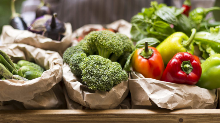 Close up of fresh and juicy vegetables from garden bed